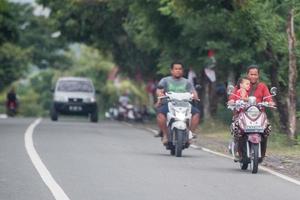 DENPASAR, BALI, INDONESIA - AUGUST 15, 2016 - Indonesia people biking photo