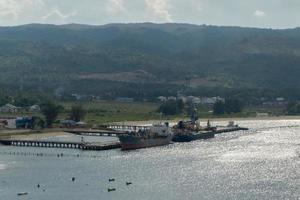 A ship anchored at Malahayati harbor at Aceh Besar Indonesia. Cargo ship at Malahayati port. photo