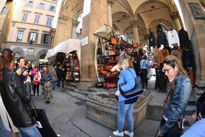 FLORENCE, ITALY - MARCH 27 2017 - Tourist touching fortune boar pig in Florence photo