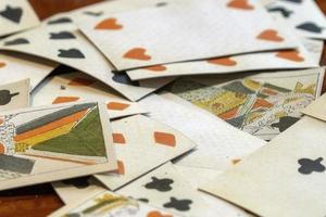 old medieval playing cards set on a table photo
