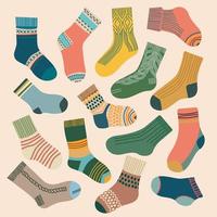 Socks set different colors and sizes knitted flat design vector illustration.Trendy socks. Stylish woolen and cotton sock design with texture and pattern.