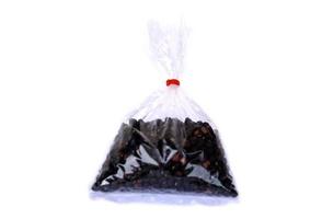 Transparent plastic bag that contains bean seeds inside, isolated on white background. Concept, packaging pattern in daily life. Keep things or food in plastic bag. container in grocery or kitchen. photo