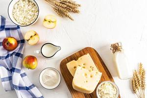 a beautiful festive backdrop for the spring Jewish holiday of Shavuot. traditional treats and symbols of the holiday. top view. space for text. photo
