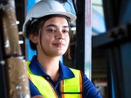 female woman person wear white hardhat helmet safety uniform factory work job career occupation forklift logistic container import export lady people beautiful cargo supply chain technology machine photo