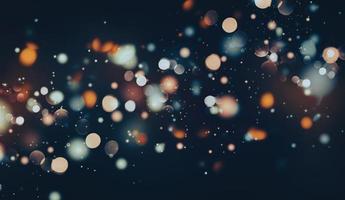 Glittering particles flying background, bokeh lights at night, blurry shiny speckles, orange blue white on black, wide banner size photo