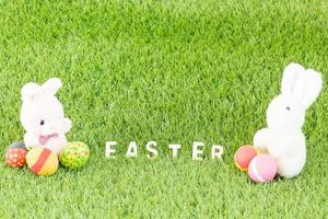 Bunny toy and Easter eggs with text photo