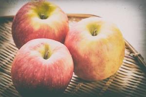 Red apple in basket photo