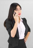 Asian women in suit standing posing using  phone photo