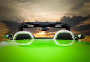 The green car with sunset photo