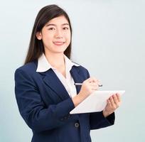 Teenage girl in suit using computer digital tablet photo