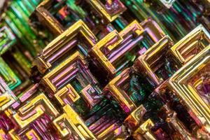 Macro of the mineral bismuth stone on a white background photo