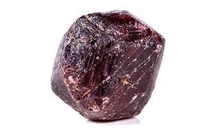 Macro of a mineral garnet stone on a white background photo