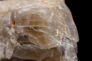 Macro mineral stone Moonstone a black background photo