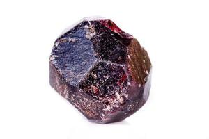 Macro of a mineral garnet stone on a white background photo