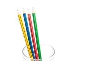 4 Sharp Color Pencils close up in a glass on white background ,for education background photo