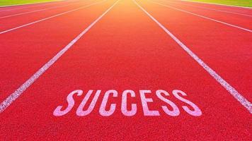 Success text written on an athletics track concept for business planning strategies and challenges or career path opportunities and change, road to success concept photo