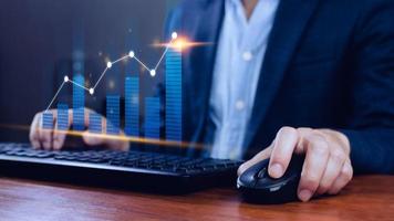 Businessman finger touch symbol stock graph and chart background, concept growth and development business investment, Stock market and strategy making market plan and stock market fluctuations photo