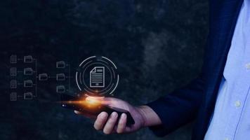 Document Management System DMS on smartphone, Online documentation database process automation to efficiently manage files, knowledge and documentation enterprise with ERP. photo
