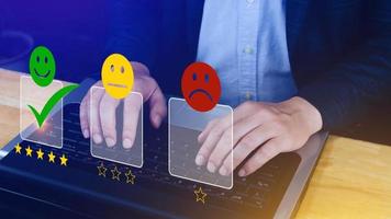 Businessman choosing happy smile face icon. feedback rating and positive customer review experience, satisfaction survey. mental health assessment. photo