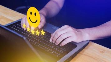 Customer services best excellent business rating experience, Positive Review and Feedback, Satisfaction survey concept. Hand of a businessman show happy smile face with five star. photo