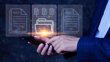 Document Management System DMS being setup IT consultant working on smartphone. Software for archiving, searching and managing corporate files information photo