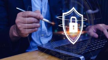 Computer network protection, secure and safe your data concept, businessman holding shield protection icon, Security shield Lock Security Businessman Protect Concept photo
