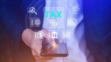 Business using smart phone to complete Individual income tax return form online for tax payment. Government, state taxes. Data analysis, paperwork, financial research, Calculation tax return. photo