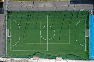 soccer field between houses aerial drone photo