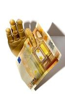 Wooden hand holding euro currency photo