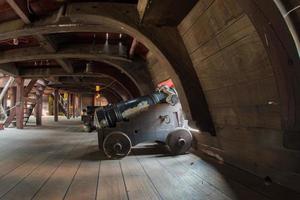 iron cannon on sail ship photo