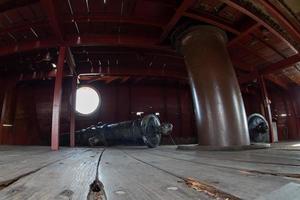 iron cannon on sail ship photo