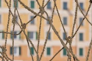 Colorful italian building over a fisherman net photo