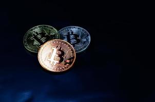 Bitcoin coins on dark background,symbol of electronic virtual money and mining cryptocurrency concept.Coin crypto currency bitcoin concept. photo