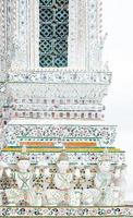 Detail of the temple of Wat Arun with statues of demon guardians,Thailand iconic decorated by ceramics ,Amazing Thailand. Bangkok, Thailand photo