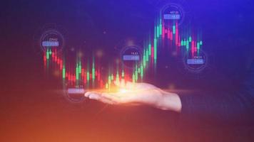 Hand of businessman or trader is showing growing virtual hologram stock, planning and strategy, Stock market, Business growth, progress or success concept. invest in trading. photo