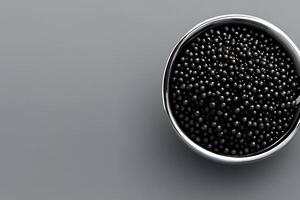 Luxury caviar egg on a stainless steel bowl and some negative space. photo