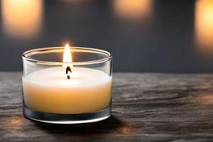 A candle in a glass plate on the table and negative space. Aromatherapy candle. photo