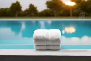 Clean two white color folded towel nice and tidy stack each other at the fitness, bath, swimming, swimming pool side for marketing background and design material. photo
