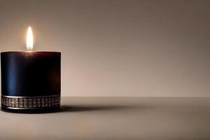 An isolated black candle on dark white background and negative space. Aromatherapy candle. photo