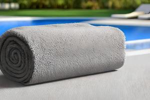 Clean grey color roll towel nice and tidy stack each other at the fitness, bath, swimming, swimming pool side for marketing background and design material. photo