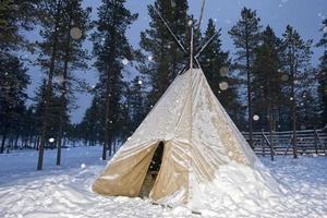 teepee in the snow background photo