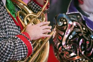 clown hands playing trumpet photo