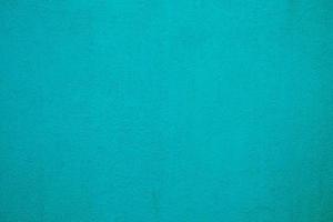 Beautiful Turquoise Painting on Stucco Wall Texture Background. photo