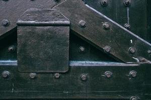 Close up Ancient Prison Gate Background in the Dark Tone. photo