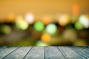 Wood Table with Blurred Bokeh of Cityscape Background, Suitable for Product Display and Mockup. photo