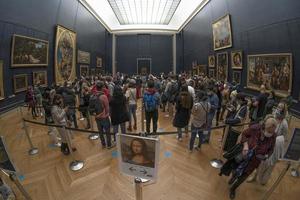 PARIS, FRANCE - NOVEMBER 18 2021 - Mona Lisa room is crowded of people photo