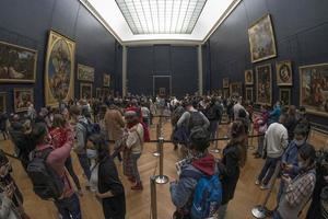 PARIS, FRANCE - NOVEMBER 18 2021 - Mona Lisa room is crowded of people photo