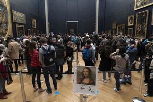 PARIS, FRANCE - NOVEMBER 18 2021 - Mona Lisa room is crowded of people photo