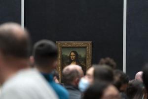 PARIS, FRANCE - NOVEMBER 18 2021 - Mona Lisa room is crowded of people photo