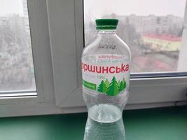 KYIV, UKRAINE - DECEMBER 18, 2023 Plastic bottle of mineral water photo